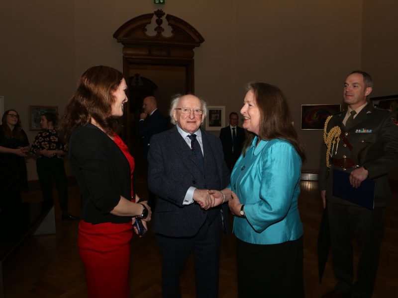 Aideen Ireland being congratulated by President Higgins, watched on by Leah Benson (NGI)