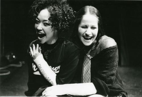 Black and white production photograph from Amy the Vampire, featuring Ruth Negga: two actors laughing together