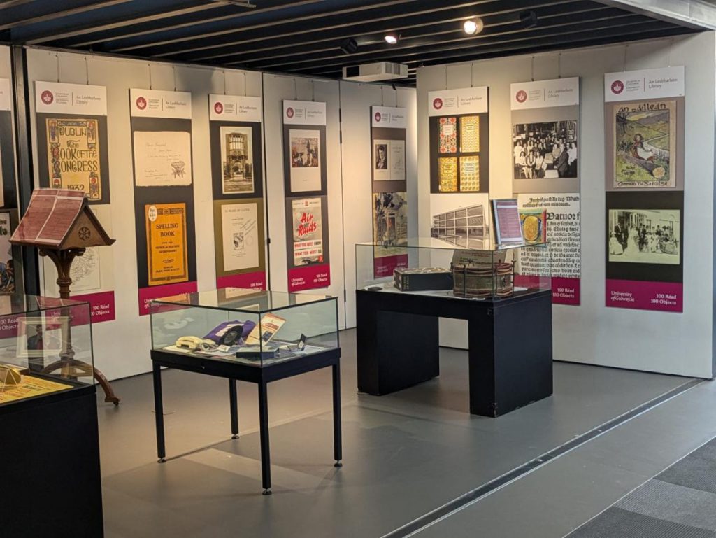 Exhibition panels and display cases in a library gallery, from the History of the Library in 100 Objects