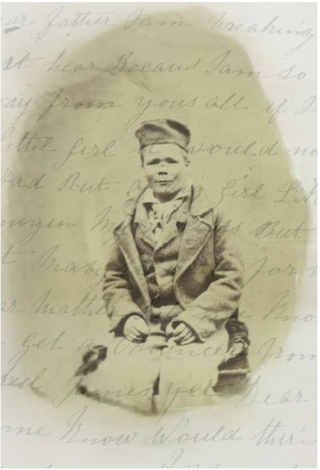 Faded photograph of a young boy in a cap and coat, printed over a handwritten letter