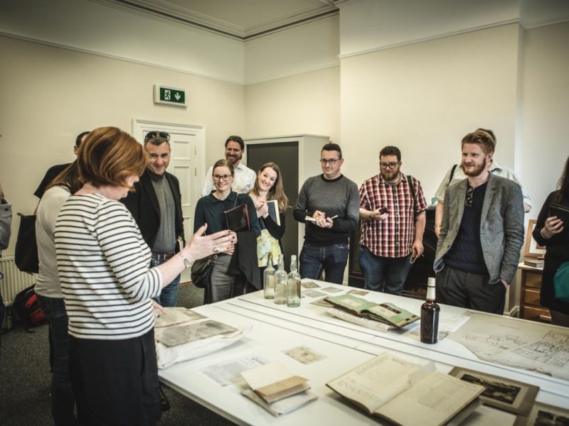 Carol Quinn showing collections at Irish Distillery Archives