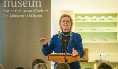 Former President Mary Robinson speaking at a lectern at the National Museum of Ireland