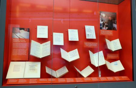 Display case of Seamus Heaney's notebooks and manuscripts from the Listen Now Again exhibition at the National Library of Ireland