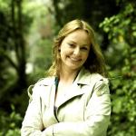 Portrait of Niamh Ní Charra outdoors among trees