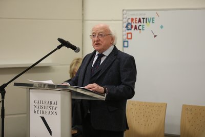 President Michael D. Higgins speaking at a lectern at the National Gallery of Ireland