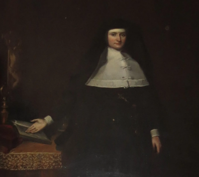 Oil portrait of a nun in a black habit with a white collar, holding a book