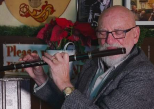 Matt Molloy playing a wooden flute