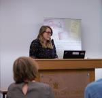 Karen de Lacey speaking at a lectern